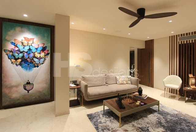 Contemporary-Living-Room-incorporating-Sofa-Set-Coffee-Table-over-a-Rug-End-Tables-with-Flower-Vases-T.V.-Unit-with-Wooden-Slits-behind-Free-Standing-Shelves-for-keeping-Antiques-Books Swiper Content 2