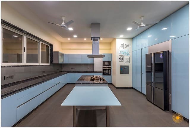 Contemporary-Styled-Light-Blue-Coloured-Island-Kitchen-comprises-of-L-Shaped-Kitchen-Counter-with-Dark-Grey-Shaded-Grained-Kitchen-Countertop-1 Swiper Content 0