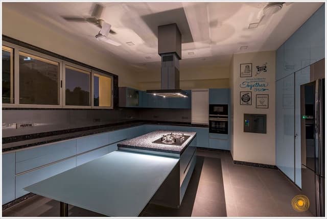 Contemporary-Styled-Light-Blue-Coloured-Island-Kitchen-comprises-of-L-Shaped-Kitchen-Counter-with-Dark-Grey-Shaded-Grained-Kitchen-Countertop-3 Swiper Content 2