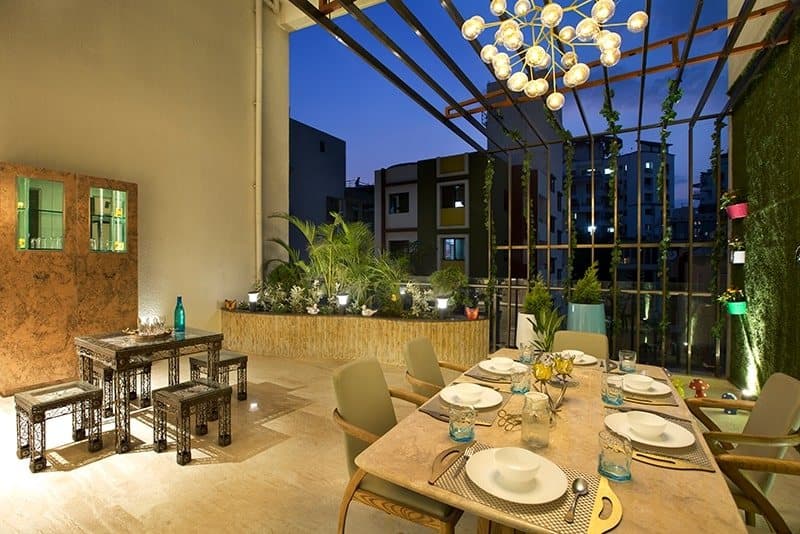 Contemporary-Styled-Semi-Open-Dining-Area-incorporates-6-Seater-Dining-Table-with-Marble-Tabletop-with-Modern-Atomic-Chandelier-above Design Detail Banner 1