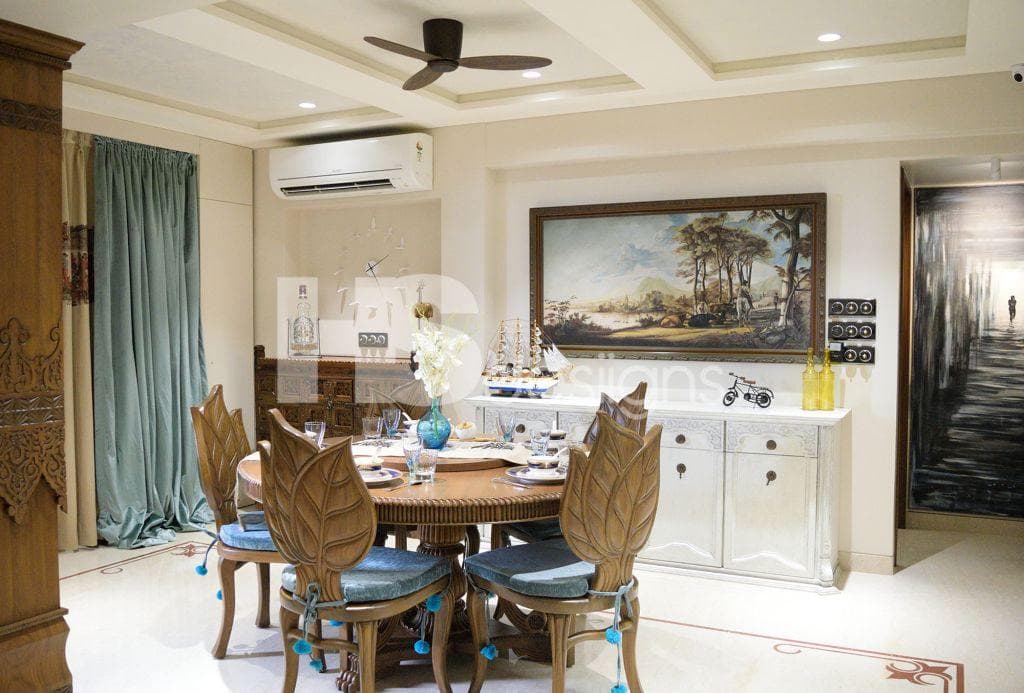 Dining-Room-accommodating-Circular-Wooden-Dining-Table-Wooden-Chair-with-Cushioned-Seating-and-Leaf-Shaped-Wooden-Backrest-Floor-Mounted-Cabinet-for-Storage. Design Detail Banner 0