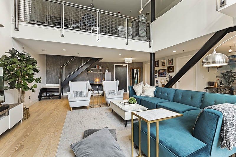 Double-Heighted-Living-Room-with-Glazed-Facade-Wooden-Flooring-comprises-of-Sea-Blue-Velvet-Fabric-Upholstered-Sectional-Sofa-with-Right-Facing-Chaise-1 Design Detail Banner 3