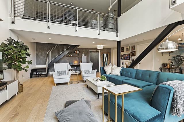 Double-Heighted-Living-Room-with-Glazed-Facade-Wooden-Flooring-comprises-of-Sea-Blue-Velvet-Fabric-Upholstered-Sectional-Sofa-with-Right-Facing-Chaise-1 Swiper Content 3