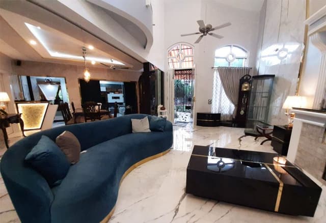 Double-Heighted-Living-Room-with-Marble-Flooring-highlighted-with-Metal-Strip-Inlay-Light-Blue-Low-Back-Upholstered-Sofa-with-Golden-Metal-Base Swiper Content 1