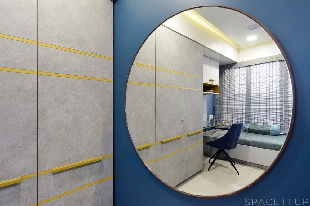 Dressing-Area-with-Oversized-Circular-Wall-Mounted-Mirror-Ceiling-Fitted-Wooden-Wardrobe-with-Attached-Study-Table-with-Glass-Top-Wall-Mounted-Wooden-Storage-Cabinet Dressing Area with Oversized Circular Wall Mounted Mirror Ceiling Fitted Wooden Wardrobe with Attached Study Table with Glass Top Wall Mounted Wooden Storage Cabinet