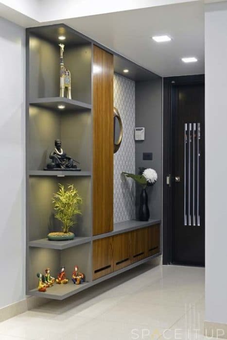 Entrance-Foyer-Area-with-Wooden-Jali-Door-with-Vertical-Slits-Ceiling-Fitted-Open-Display-Cabinet-with-Shelves-highlighted-with-Spot-Lights Design Detail Banner 0