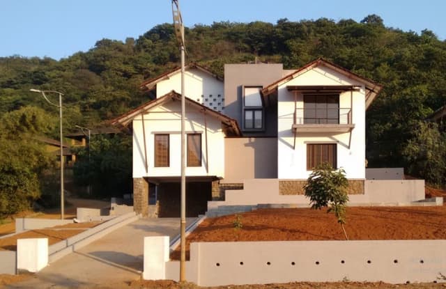 Exterior-View-of-2-Storeyed-White-Beige-Coloured-Traditional-Bungalow-with-Sloping-Roofs-01 Swiper Content 0