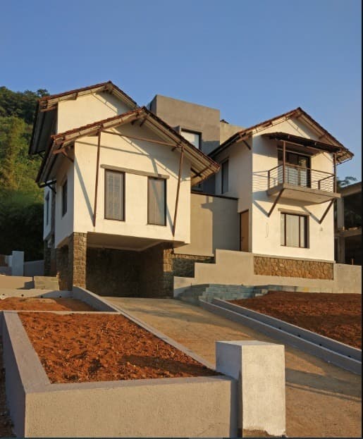 Exterior-View-of-2-Storeyed-White-Beige-Coloured-Traditional-Bungalow-with-Sloping-Roofs-02 Design Detail Banner 1