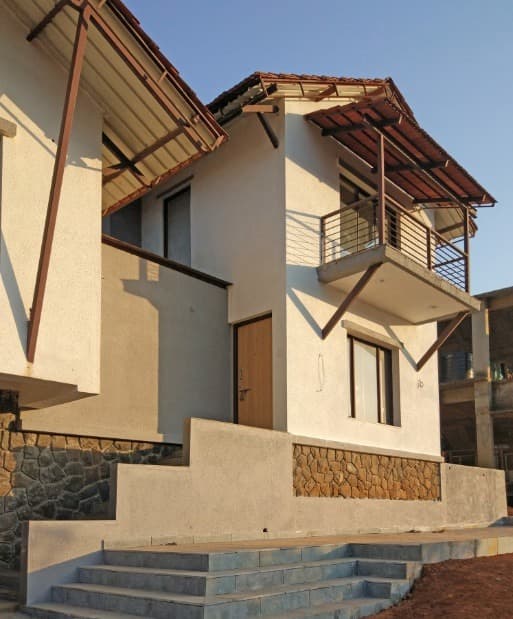 Exterior-View-of-2-Storeyed-White-Beige-Coloured-Traditional-Bungalow-with-Sloping-Roofs-04 Swiper Content 3