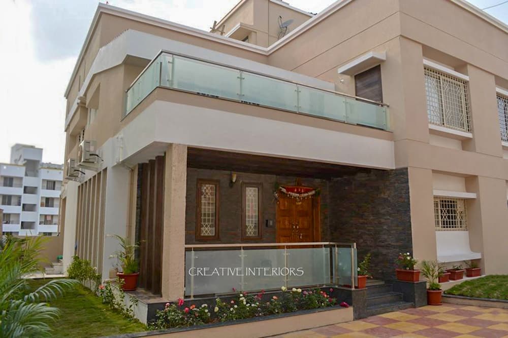 Exterior-View-of-Contemporary-styled-G1-Bungalow-in-White-Beige-Colour-1 Design Detail Banner 0