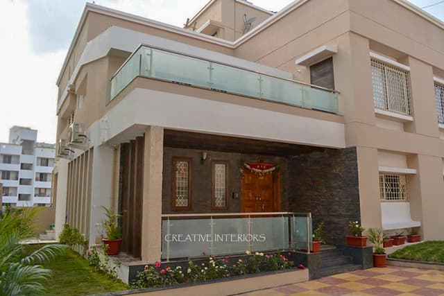 Exterior-View-of-Contemporary-styled-G1-Bungalow-in-White-Beige-Colour-1 Swiper Content 0