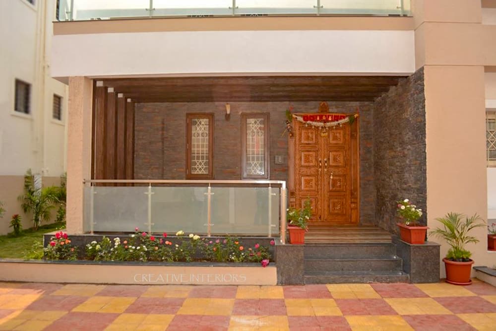 Exterior-View-of-Contemporary-styled-G1-Bungalow-in-White-Beige-Colour.-1 Design Detail Banner 1