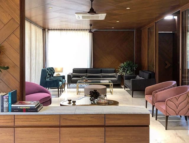 Formal-Living-Room-incorporating-Square-Armed-Grey-Upholstered-Sofa-Set-Indoor-Potted-Plant-Side-Table-with-Table-Lamp-Glass-Coffee-Table. Swiper Content 0