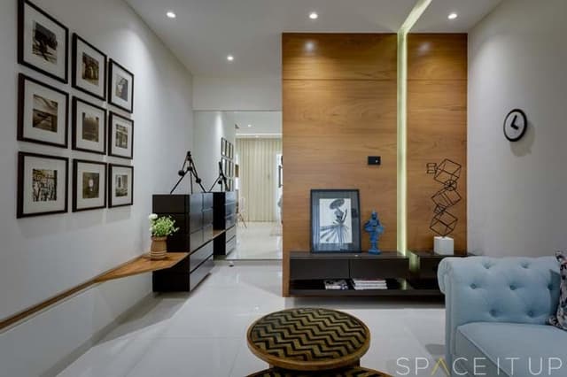 Framed-Picture-Collage-on-one-Wall-highlighted-by-Recessed-Ligthing-from-above Swiper Content 0