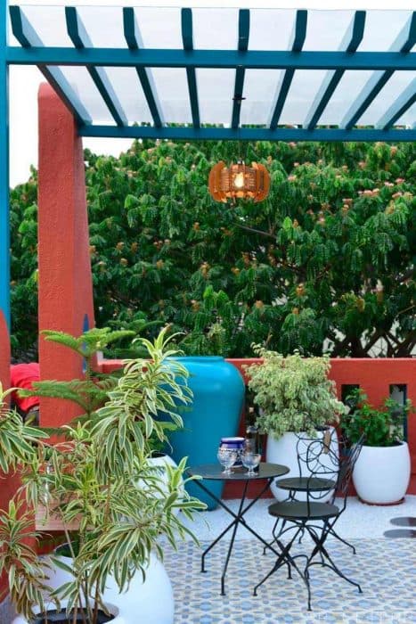 Home-Garden-on-Terrace-Floor-having-Parapet-Wall-with-Red-Wall-Paint-having-Voids-with-Blue-Wall-Paint-10 Design Detail Banner 8