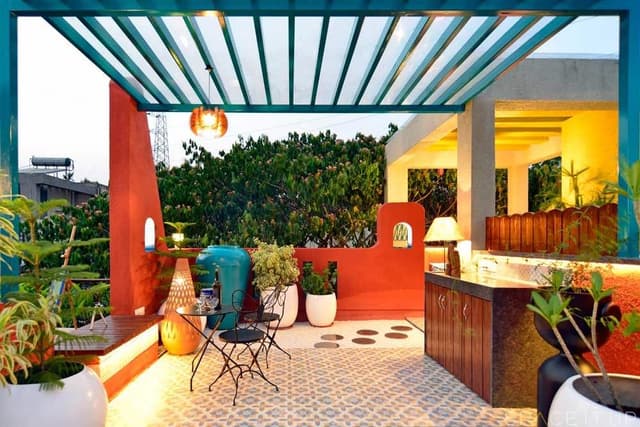 Home-Garden-on-Terrace-Floor-having-Parapet-Wall-with-Red-Wall-Paint-having-Voids-with-Blue-Wall-Paint-11 Swiper Content 9