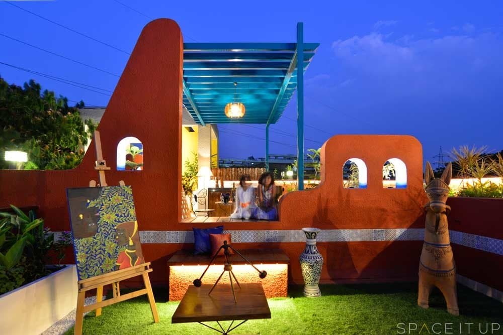 Home-Garden-on-Terrace-Floor-having-Parapet-Wall-with-Red-Wall-Paint-having-Voids-with-Blue-Wall-Paint-4 Design Detail Banner 3