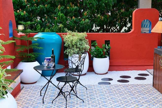 Home-Garden-on-Terrace-Floor-having-Parapet-Wall-with-Red-Wall-Paint-having-Voids-with-Blue-Wall-Paint-5 Swiper Content 4