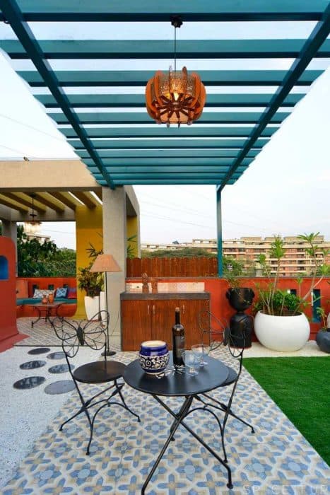 Home-Garden-on-Terrace-Floor-having-Parapet-Wall-with-Red-Wall-Paint-having-Voids-with-Blue-Wall-Paint-9 Design Detail Banner 7