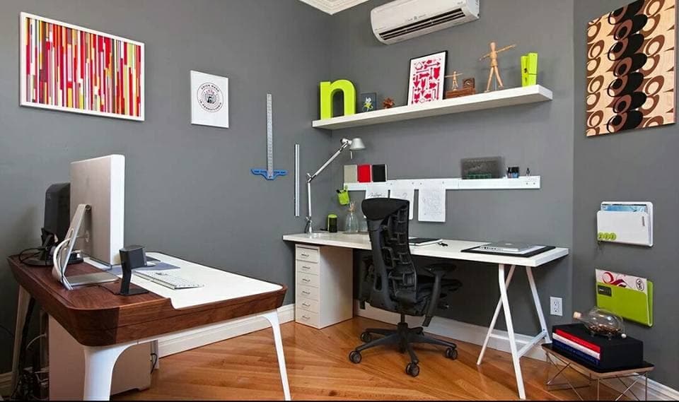 Home-Office-with-a-Wooden-Flooring-accommodates-White-Wooden-Working-Desk-Aligned-to-Wall-with-Drawers-underneath-Shelves-above-for-Decor. Design Detail Banner 0