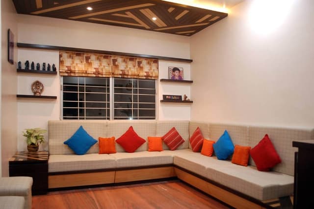 L-Shaped-Cushioned-Wooden-Sectional-Sofa-with-Colourful-Cushions Swiper Content 0