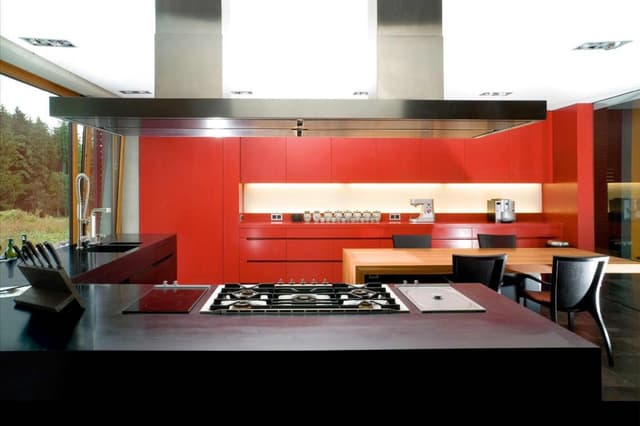 L-Shaped-Kitchen-with-Black-Granite-Kitchen-Countertop-Built-in-Stove-with-Ceiling-Mounted-Chimney-Bar-Counter-with-Lower-Kitchen-Cabinets L-Shaped Kitchen with Black Granite Kitchen Countertop