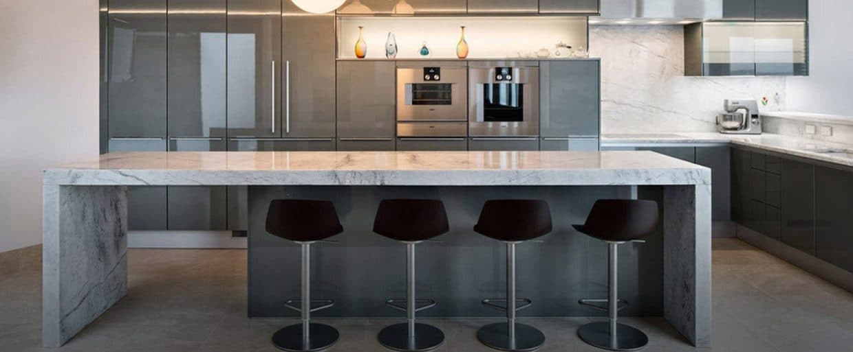 L-Shaped-Modular-Kitchen-in-Grey-White-Theme-accommodating-White-Marble-Countertop Design Detail Banner 0