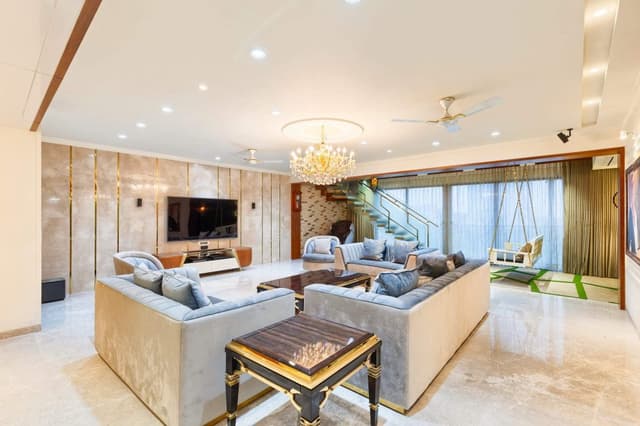 Lavish-Living-Room-comprising-Square-Armed-Sofa-Set-Rectangle-Coffee-Table-Square-End-Table-Side-Nesting-Tables-Sofa-Chairs-Recliner-Under-Canteliver-Staircase-Swing-in-front-of-Stairs-1 Swiper Content 2