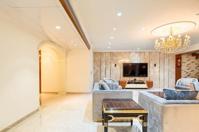 Lavish-Living-Room-comprising-Square-Armed-Sofa-Set-Rectangle-Coffee-Table-Square-End-Table-Side-Nesting-Tables-Sofa-Chairs-Recliner-Under-Canteliver-Staircase-Swing-in-front-of-Stairs-4 Swiper Content 3