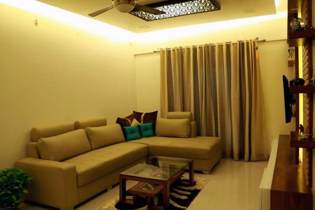 Living-Room-comprising-Fabric-Tufted-L-Shaped-Bolster-Sofa-02 Swiper Content 1