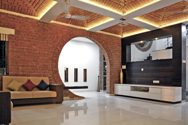 Living-Room-comprising-of-Square-Armed-Cushioned-Sofa-Exposed-Brick-Sofa-Back-Wall-with-Circular-Opening-01 Swiper Content 0