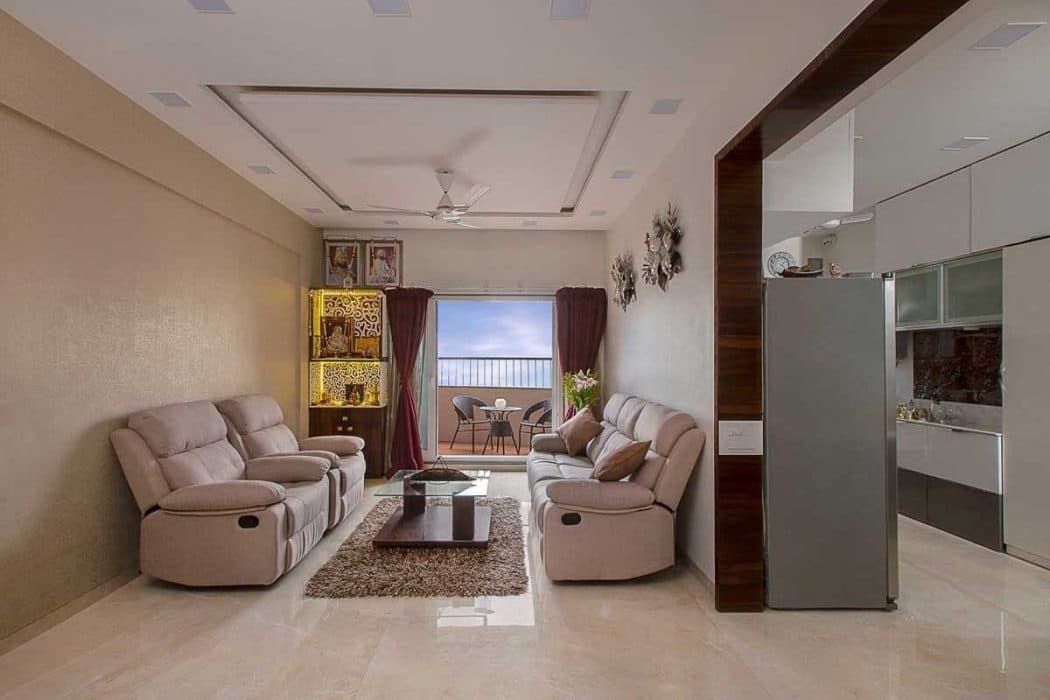Living-Room-designed-with-Cream-Beige-Theme-incorporating-Leather-Upholstered-Recliner-Sofa-Set-Glazed-Coffee-Table-placed-on-a-Rug-Side-Table-with-a-Flower-Vase-placed-on-it-TV-unit Design Detail Banner 2
