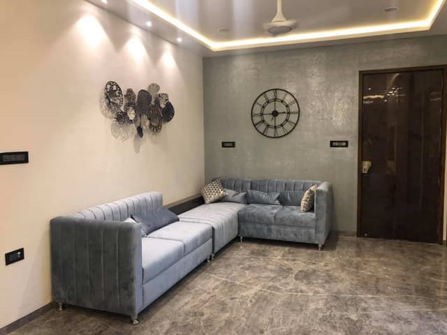 Living-Room-designed-with-Formal-Informal-rooms-accommodating-Velvet-upholstered-Grey-Coloured-Square-Armed-Modern-Sectional-Tuxedo-Style-Sofa-2 Swiper Content 1