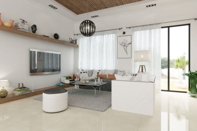 Living-Room-in-White-Theme-comprising-L-Shaped-Sectional-Sofa-Coffee-Table-placed-on-a-Rug-Round-Pouf-Wall-mounted-T.V. Swiper Content 0