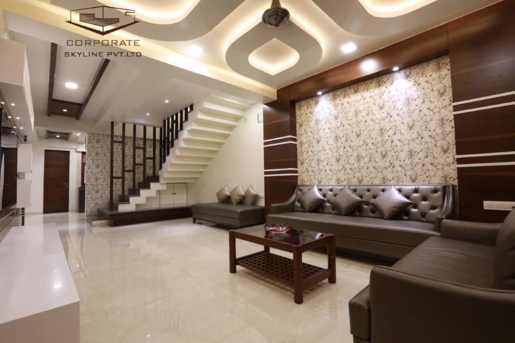 Living-Room-incorporating-Dark-Brown-Leather-Tufted-Upholstered-Sofa-Wooden-Coffee-Table-with-Glass-Top-Wooden-Shelf-below Design Detail Banner 0