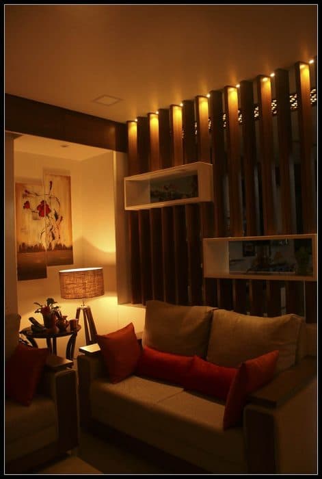 Living-Room-incorporating-Sofa-Set-with-Wooden-Base-Orange-Cushions-Wooden-Side-Table Swiper Content 1