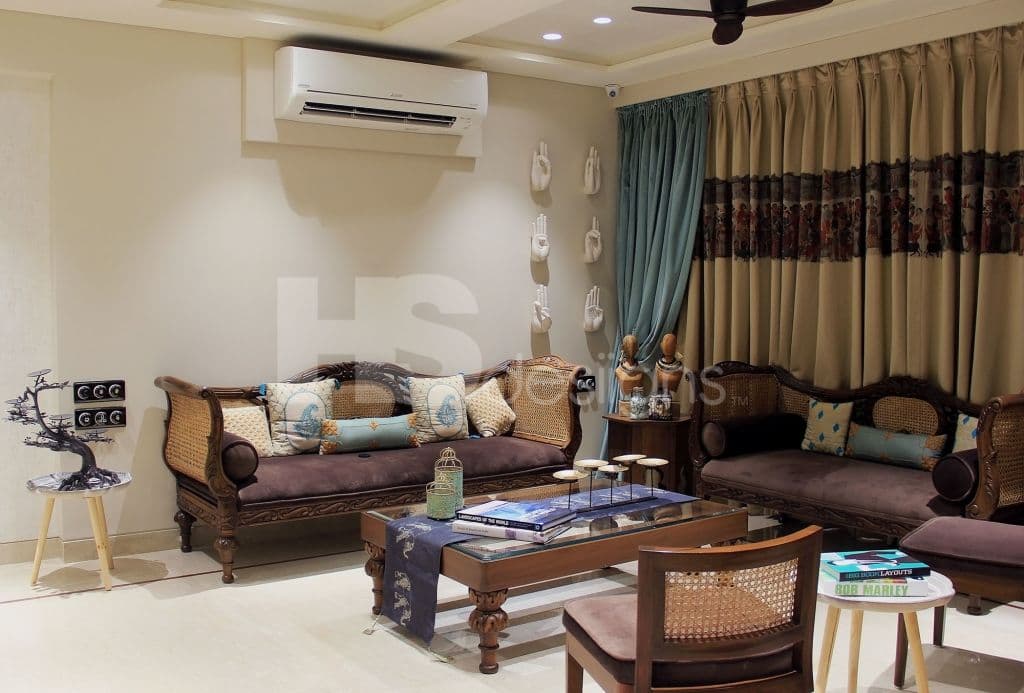 Living-Room-incorporating-Traditional-Wicker-Sofa-Sets-with-Carved-Wooden-Frames-Wooden-Side-Tables-with-Statues-Traditional-Wooden-Coffee-Table Design Detail Banner 0