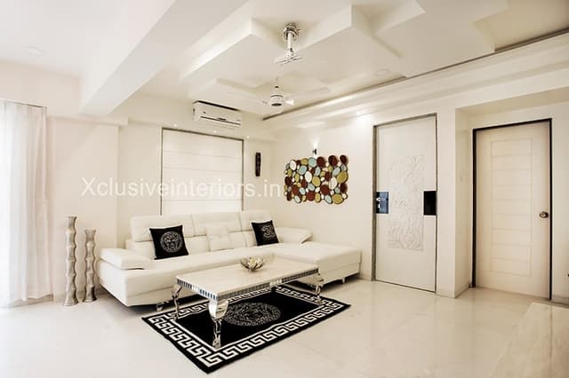 Living-Room-incorporating-White-Leather-Upholstered-L-Shaped-Sectional-Sofa Swiper Content 0