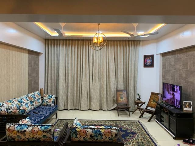 Living-Room-incorporating-Wooden-Sofa-Set-with-Printed-Sofa-Cushions-Rug Swiper Content 0