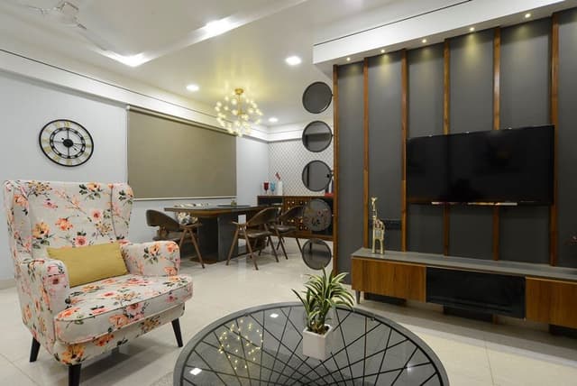 Living-Room-incorporating-Yellow-Coloured-Square-Armed-L-Shaped-Sectional-Sofa-with-Left-Facing-Chaise-Floral-Fabric-Upholstered-Wing-Chair-with-High-Back-3 Swiper Content 2