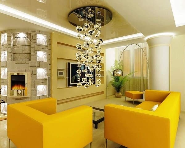Living-Room-incorporating-Yellow-Square-Armed-Sofa-Set-Low-Heighted-Coffee-Table-with-Glass-Top-Yellow-Ottoman-TV-Unit-with-Shelves-and-Stone-Cladded-Curved-Wall-with-Niches. Design Detail Banner 0