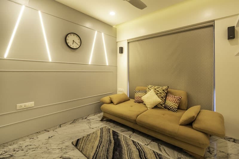 Low-Seater-Upholstered-Sofa-with-Cushions-in-front-of-Wall-with-Window-having-Roller-Blinds Design Detail Banner 0