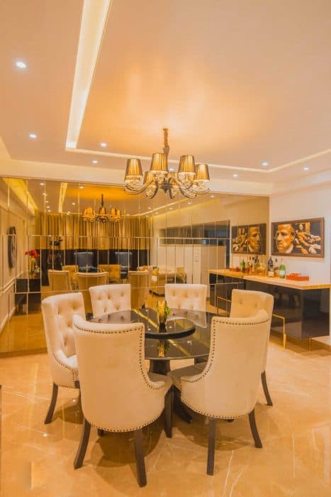 Luxe-Dining-Room-with-6-Seater-Lazy-Susan-Dining-Table-Off-White-coloured-Tufted-Upholster-Dining-Chairs-with-Studs. Design Detail Banner 0