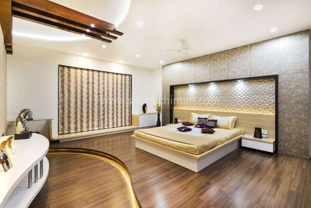 Luxurious-Bedroom-with-Wooden-Flooring-comprises-of-Curved-Raised-Platform-with-Wooden-Flooring-highlighted-by-Cove-Light-1 Swiper Content 0