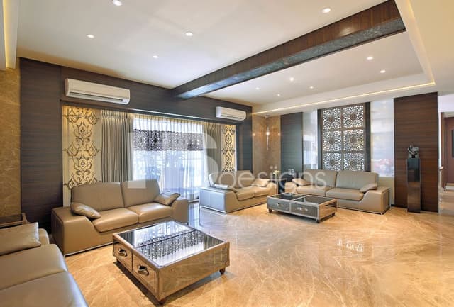 Luxurious-Living-Room-accomodating-Mid-Century-Vintage-Leather-SofasTreasure-Chest-Coffee-Tables-with-Glass-Top. Swiper Content 0