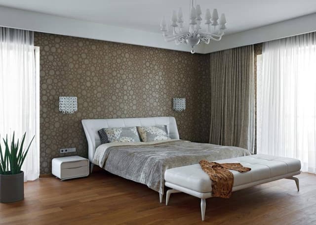 Modern-Bedroom-designed-with-Wooden-Bed-with-Legs-Side-Tables-Bed-End-Bench-Indoor-plants-Textured-Wallpaper-on-Bed-Backwall Swiper Content 0