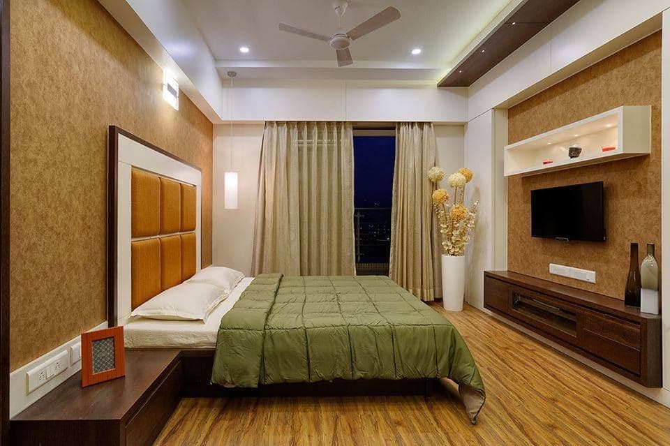 Modern-Bedroom-in-Burnt-Orange-Theme-designed-with-Wooden-Bed-High-Back-Cushioned-Headboard-Wooden-Side-Tables-1 Design Detail Banner 0