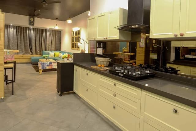 Modern-Large-Parallel-Kitchen-with-a-Glass-Portion-separating-Wash-Area.-A-Kitchen-Starts-with-a-Wooden-Storage-Unit-on-Wheels-that-highlights-a-Kind-Texts-on-Drawers-3 Swiper Content 2