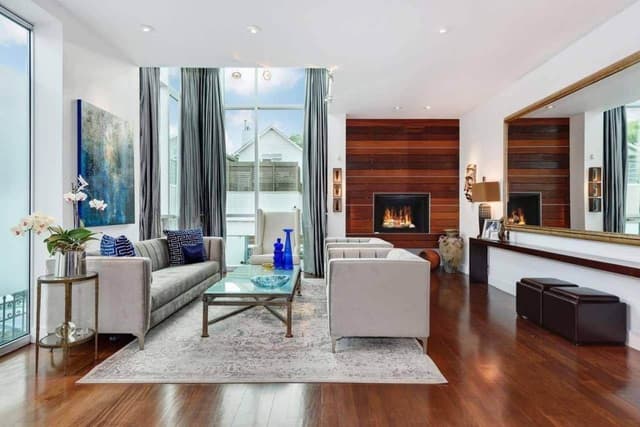 Modern-Living-Room-accommodating-Square-Armed-Sofa-Set-Glass-Top-Rectangular-Coffee-Table-placed-on-a-Rug Swiper Content 0