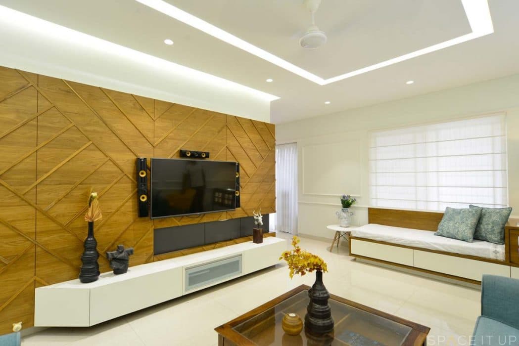 Modern-Living-Room-designed-with-Blue-Coloured-Linen-upholstered-Round-Armed-Sofa-Set-Wooden-Square-Glass-Top-1 Design Detail Banner 1